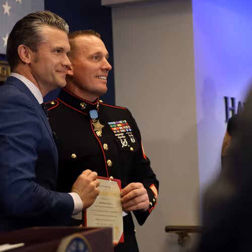 U.S. Marine Corps Sgt. Dakota Meyer, a Medal of Honor recipient, stands with Defense Secretary Pete Hegseth after reenlisting in a ceremony at the Pentagon on April 17, 2025. (Lance Cpl. Abigail Hutcheson/U.S. Marine Corps)
