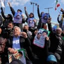 Mourners gather during a funeral procession for Alireza Tangsiri, head of Iran's Islamic Revolutionary Guard Corps Navy, and others killed in Israeli strikes in late March, in Tehran, Iran, Wednesday, April 1, 2026. (AP Photo/Vahid Salemi)