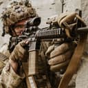 A paratrooper assigned to the 3rd Brigade Combat Team, 82nd Airborne Division aims his M4A1 carbine during a blank-fire exercise at the Joint Readiness Training Center, Fort Polk, Louisiana, March 10, 2026. Through tough, complex scenarios, paratroopers continue to adapt and build the combat-ready formations needed to fight and win anytime, anywhere. (U.S. Army photo by Sgt. Andrew Clark)