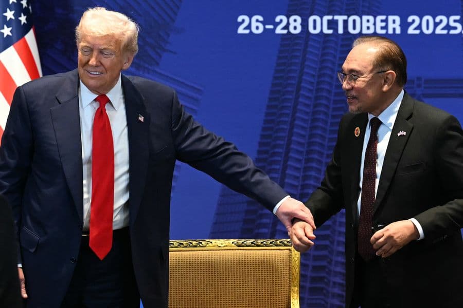 U.S. President Donald Trump gestures to Malaysia's Prime Minister Anwar Ibrahim during a bilateral meeting on the sidelines of the 47th Association of Southeast Asian Nations (ASEAN) summit in Kuala Lumpur, Malaysia, Sunday, Oct. 26, 2025. (Mohd Rasfan/Pool Photo via AP)