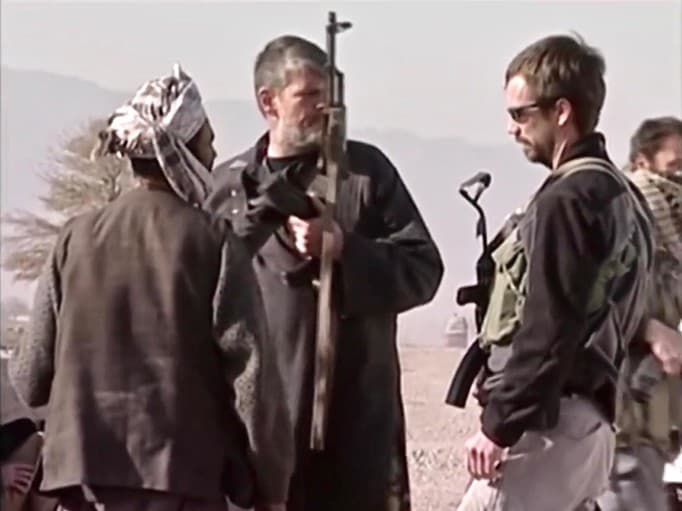Agency legend Dave Tyson in the center with CIA paramilitary Scott Spellmeyer at Qala i Jengi.