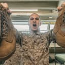 U.S. Marine Corps Recruit Jayden Brooks with Hotel Company, 2nd Recruit Training Battalion holds out his boots during Pick-Up Day at Marine Corps Recruit Depot San Diego, California, Jan. 31, 2026. Pick-Up Day signifies the first official day of training in which recruits will meet their drill instructor team for the first time, prepare their gear and squad bay, and learn about the expectations for the remainder of their time in recruit training. (U.S. Marine Corps photo by Cpl. Genaro I. Valdez-Sepulveda)
