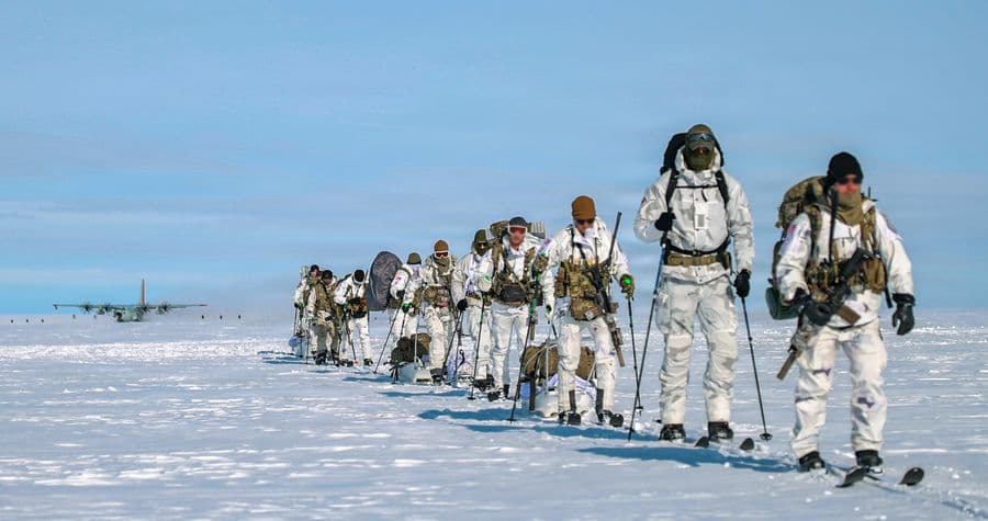Green Berets assigned to the 10th Special Forces Group (Airborne) offload from an LC-130H “Skibird” operated by the 109th Airlift Wing of the New York National Guard on Aug. 18, 2026, at Camp Raven, Greenland, as part of Operation Apex Indigo. U.S. Special Operations Command North operates in Greenland alongside Danish counterparts to evaluate basic survival, search and rescue, cold-weather mobility, and communications infrastructure operations in the harshest environment on Earth, ensuring U.S. SOF capability to survive and thrive under any circumstances. U.S. Air National Guard Photo by Master Sgt. Jamie Spaulding (This photo was altered for security purposes)