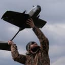 In this file photo taken Thursday, March 19, 2026, a student soldier of the Yatagan School for Unmanned Aerial Systems launches a drone during drills in the Kyiv region, Ukraine. (AP Photo/Efrem Lukatsky)