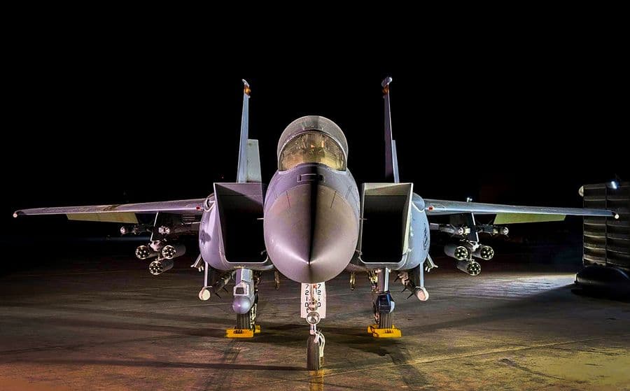 An F-15E Strike Eagle loaded up with AGR-20F Advanced Precision Kill Weapon System II laser-guided rockets waits for its next mission in the area of responsibility. (U.S. Air Force)