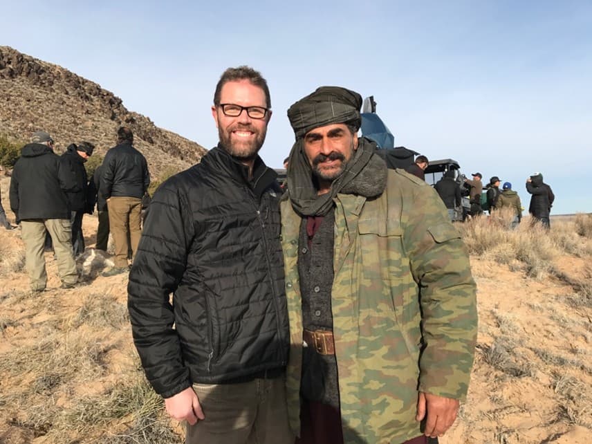 Williams with the actor Navid Negahban dressed in Marshall Dostum’s riding jacket while portraying Dostum on the New Mexico movie set for 12 Strong.