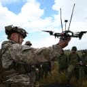 Chief Warrant Officer 3 Steven Winn, Battalion Gunner, Battalion Landing Team 1/1, 31st Marine Expeditionary Unit, points out capabilities of the Neros Archer drone for observers, October 20, 2026. (U.S. Marine Corps)