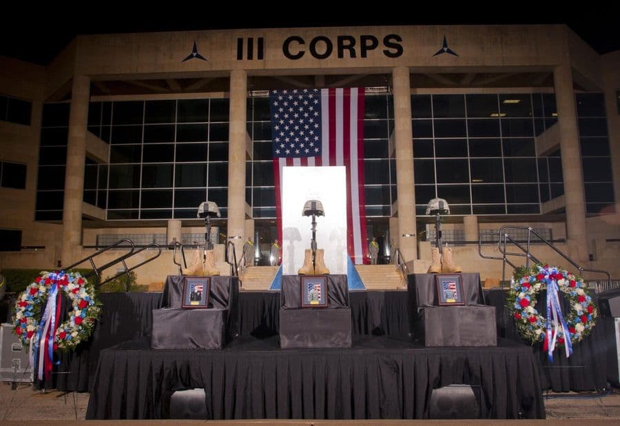 Fallen soldier memorials for Sgt. 1st Class Daniel M. Ferguson, Staff Sgt. Carlos A. Lazaney-Rodriguez, and Sgt. Timothy W. Owens stand in front of the III Corps headquarters building in the early morning of April 9, 2014. A memorial service for the ... (Photo Credit: U.S. Army)
