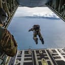 A U.S. Air Force pararescueman from the Kentucky Air National Guard’s 123rd Special Tactics Squadron jumps from a C-130J Super Hercules aircraft into the Atlantic Ocean off the coast of Scotland on Aug. 18, 2026. The Airman is conducting open-ocean rescue training with members of the Kentucky Guard’s 165th Airlift Squadron and the British Royal Navy’s 814 Naval Air Squadron. (U.S. Air National Guard photo by Dale Greer)