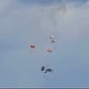 Screenshot from a video showing four parachutes deploying after two EA-18G Growlers with the “Vikings” of VAQ-129 Demo Team crash.