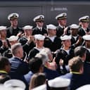 U.S. Navy sailors clap during an event for Anduril Industries, Inc., at Sparrows Point Shipyard, Tuesday, Oct. 6, 2026, in Sparrows Point, Md. (AP Photo/Julia Demaree Nikhinson)