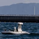 A Typhoon unmanned surface vessel demonstrates naval interception techniques during Exercise Keen Sword 27 (KS27), at Marine Corps Air Station Iwakuni, Japan, Oct. 21, 2026. The demonstration of the Typhoon was a part of the Office of the Under Secretary of War for Research and Engineering Maritime Big Play sponsored Port Defense experimentation. Keen Sword is a joint, bilateral exercise with multinational participation involving the host nation's Japan Self-Defense Force, U.S. Armed Forces, and multiple allies and partners in the Pacific region. Keen Sword is a routine, biennial bilateral field training exercise with multinational participation, designed to increase readiness and interoperability between the U.S. military and Japan Self-Defense Forces while strengthening the ironclad U.S.-Japan Alliance. (U.S. Marine Corps photo by Lance Cpl. Issac De Leon)