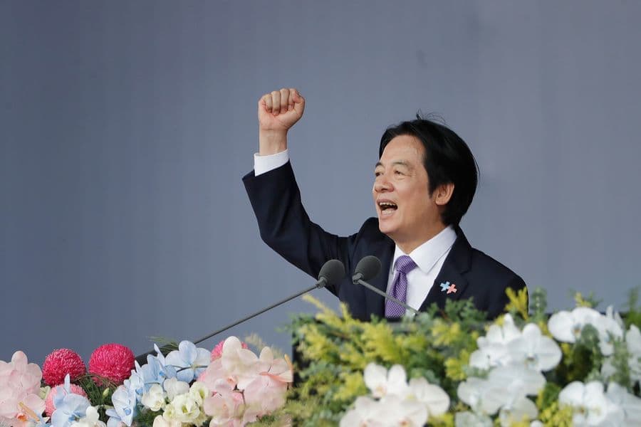 Taiwanese President Lai Ching-te cheers during National Day celebrations in front of the Presidential Building in Taipei, Taiwan, Saturday, Oct. 10, 2026. (AP Photo/Chiang Ying-ying)