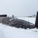 Russian sailors stand on deck of the newly-built nuclear submarine The Emperor Alexander III while Russian President Vladimir Putin attends a flag-raising ceremony on Monday for newly-built nuclear submarines at the Sevmash shipyard in Severodvinsk in Russia's Archangelsk region, Monday, Dec. 11, 2023. The navy flag was raised on the Emperor Alexander III and the Krasnoyarsk submarines during Monday's ceremony. Putin has traveled to a northern shipyard to attend the commissioning of new nuclear submarines, a visit that showcases the country's nuclear might amid the fighting in Ukraine. (Mikhail Klimentyev, Sputnik, Kremlin Pool Photo via AP)